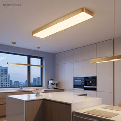 Gold LED ceiling panel lit in a white kitchen with an island