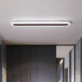 Coffee ceiling light above dark wardrobes in a bedroom