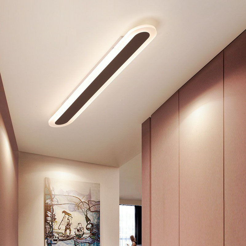 Coffee ceiling light in a hallway with warm pink walls