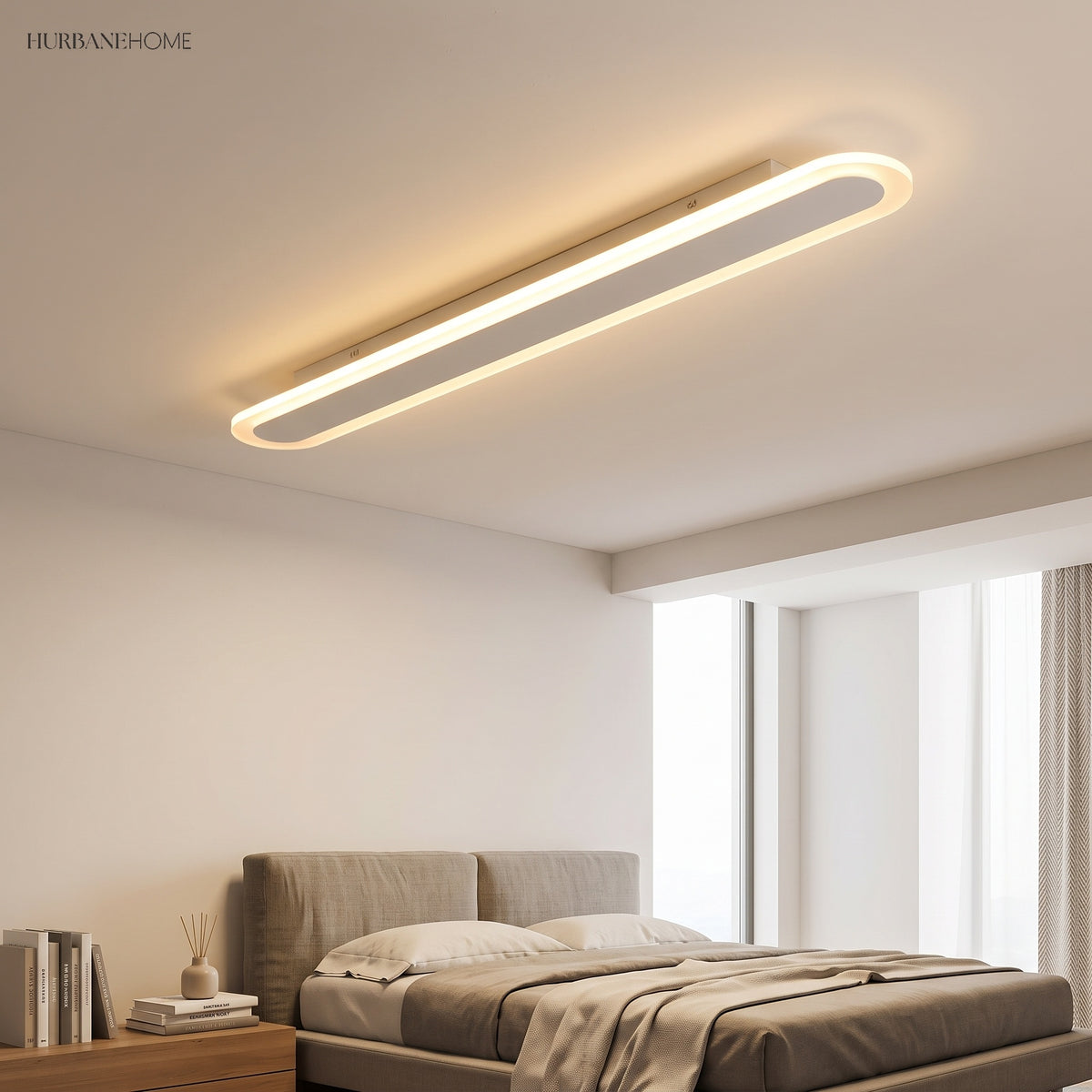 White linear ceiling fixture in a bedroom above a made bed