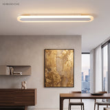 White linear ceiling light over a dining area with a city view
