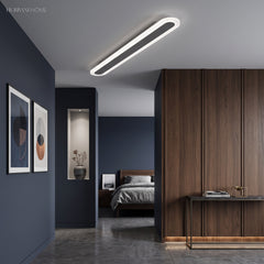 White ultra thin ceiling light in a hallway beside a navy bedroom