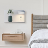 Angled view of black wall lamp head shelf and mounting panel