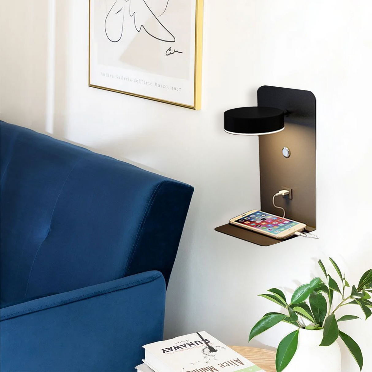 Side view of black wall lamp showing round head and shelf