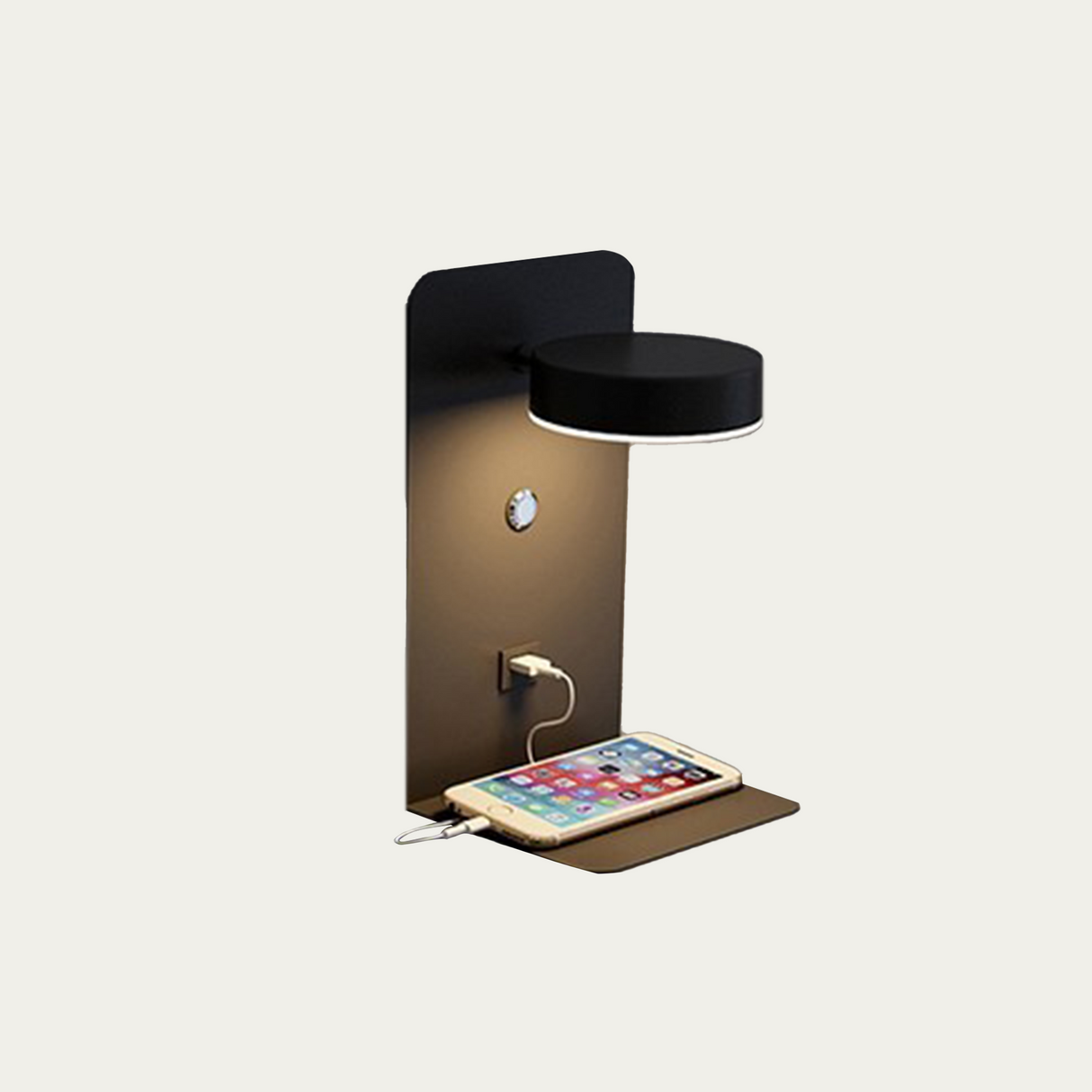 Black wall lamp with round LED head charging a phone on the shelf