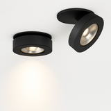 Black spotlight shown flat and tilted to show the moving head