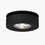 Product view of the black round spotlight with a recessed lens