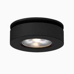 Product view of the black round spotlight with a recessed lens