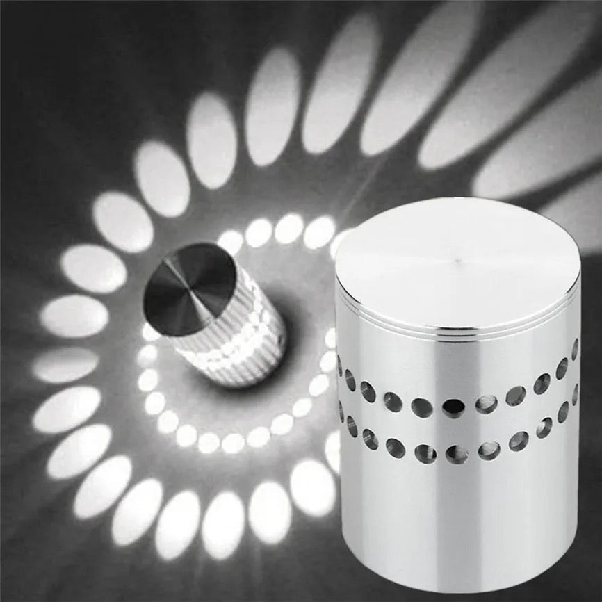 Spiral pattern beside the small aluminium cylinder that projects it