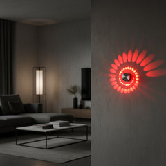 Close view of a red spiral pattern thrown across a wall
