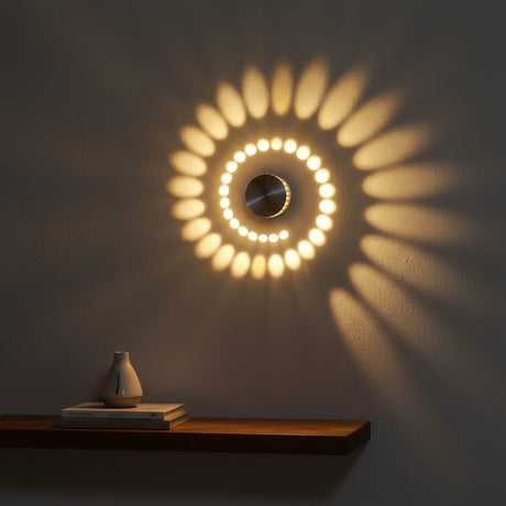 Close view of a warm white spiral pattern thrown across a wall