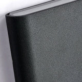 Close up of the textured black aluminum body and light slot