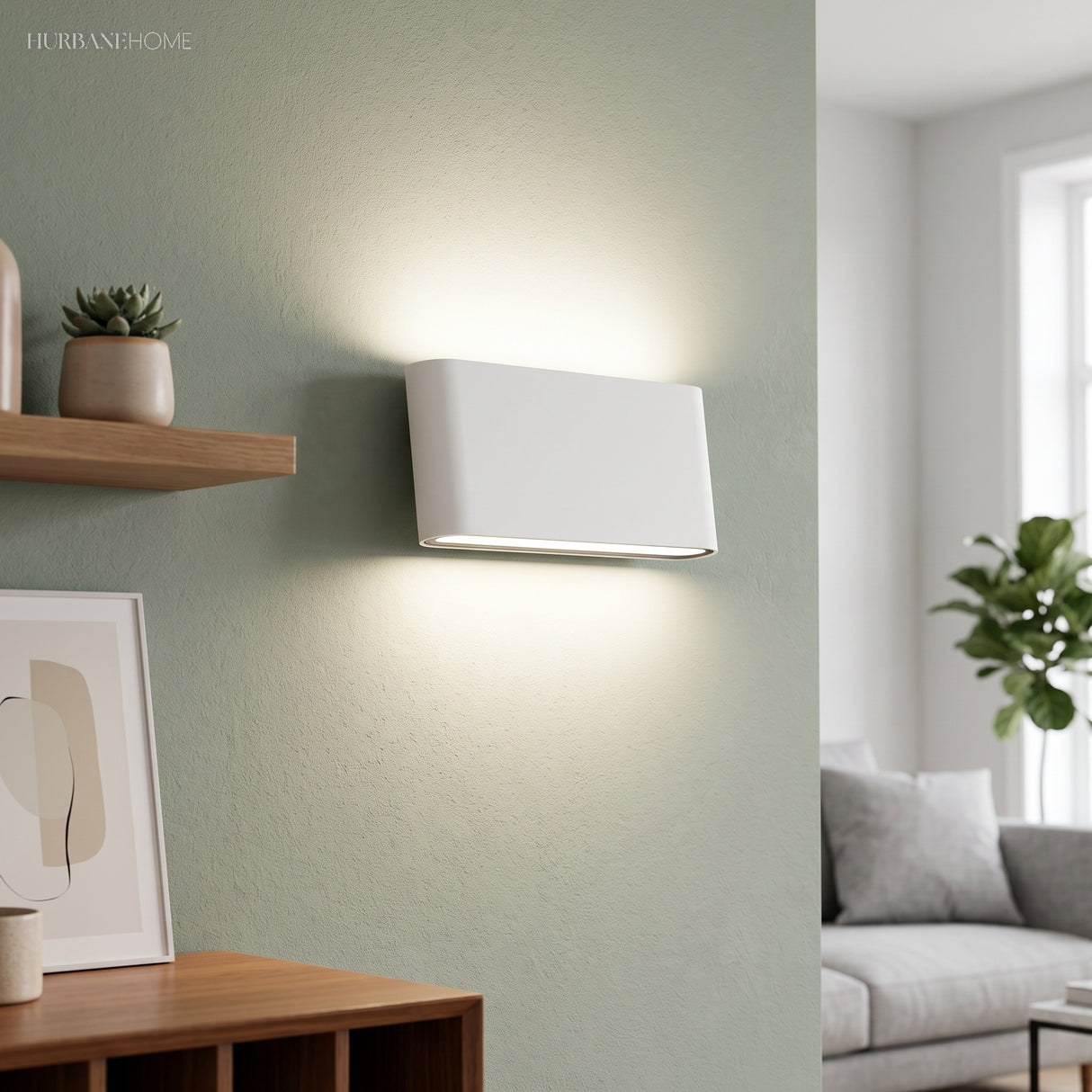 White rectangular wall sconce mounted on a sage green feature wall