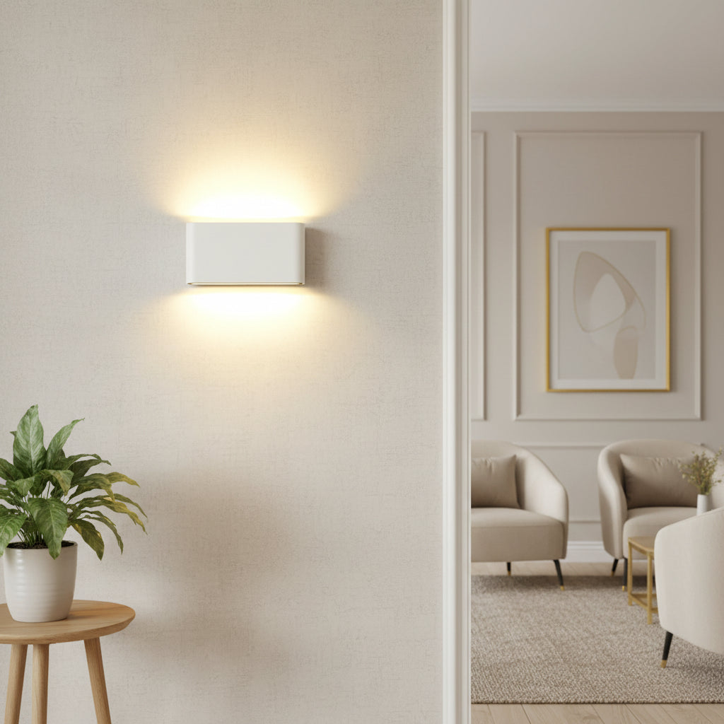 White rectangular sconce lit from both its top and bottom edges