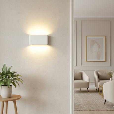 White rectangular sconce lit from both its top and bottom edges
