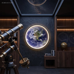 Backlit Earth wall light above a desk beside a brass lamp