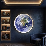 Earth globe panel lit on a dark wall beside a telescope