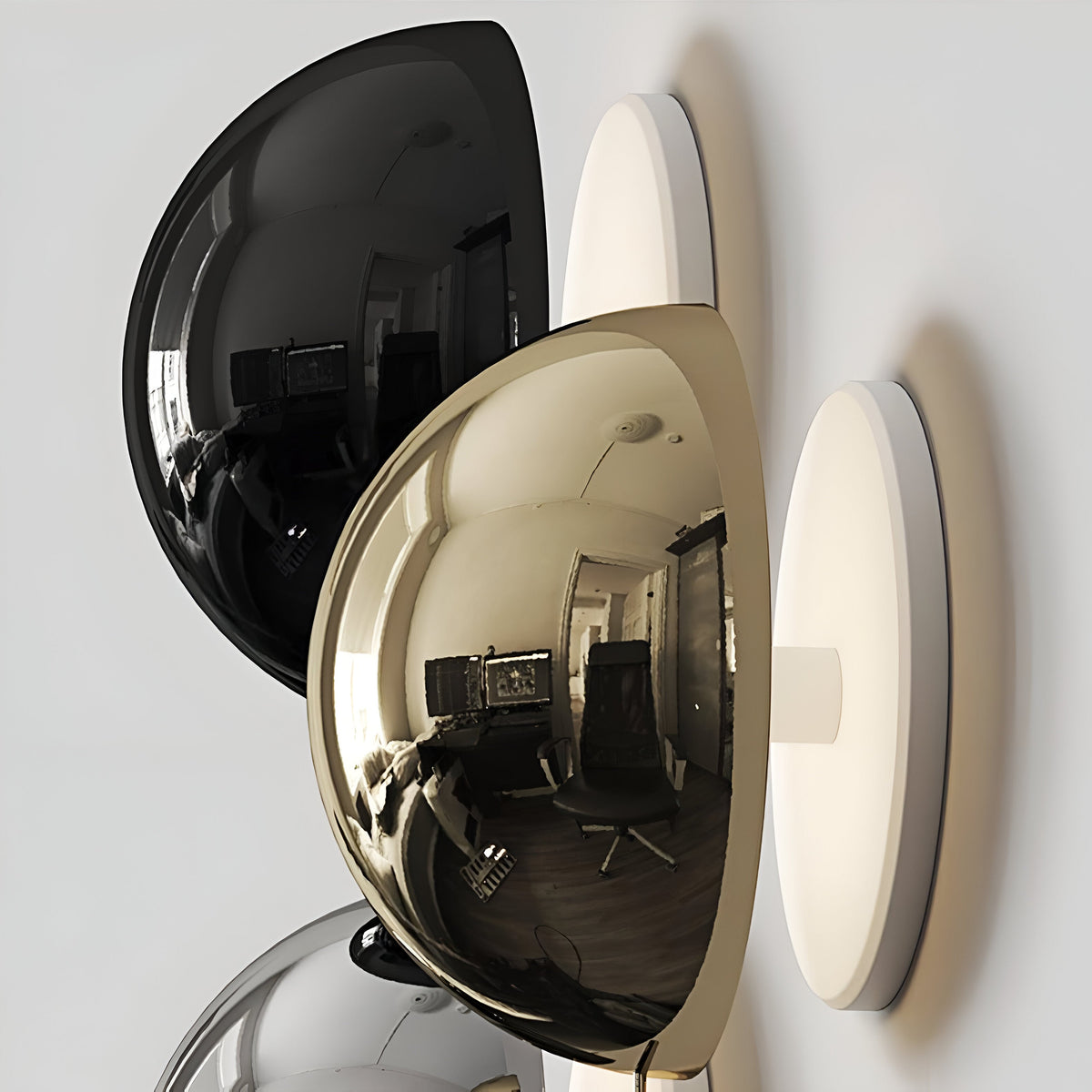 Black gold and silver dome sconces stacked to show the finishes
