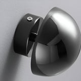 Mirrored dome sconces seen from behind showing the mounting plate