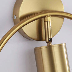 Close view of the brass arm meeting the round wall backplate