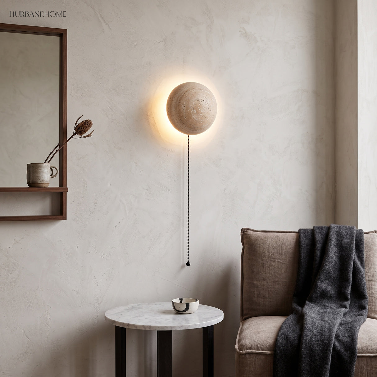 Travertine LED wall sconce beside a mirror and console in a calm styled room