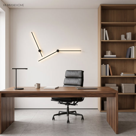 Two black linear wall lights forming an angled line above a walnut office desk