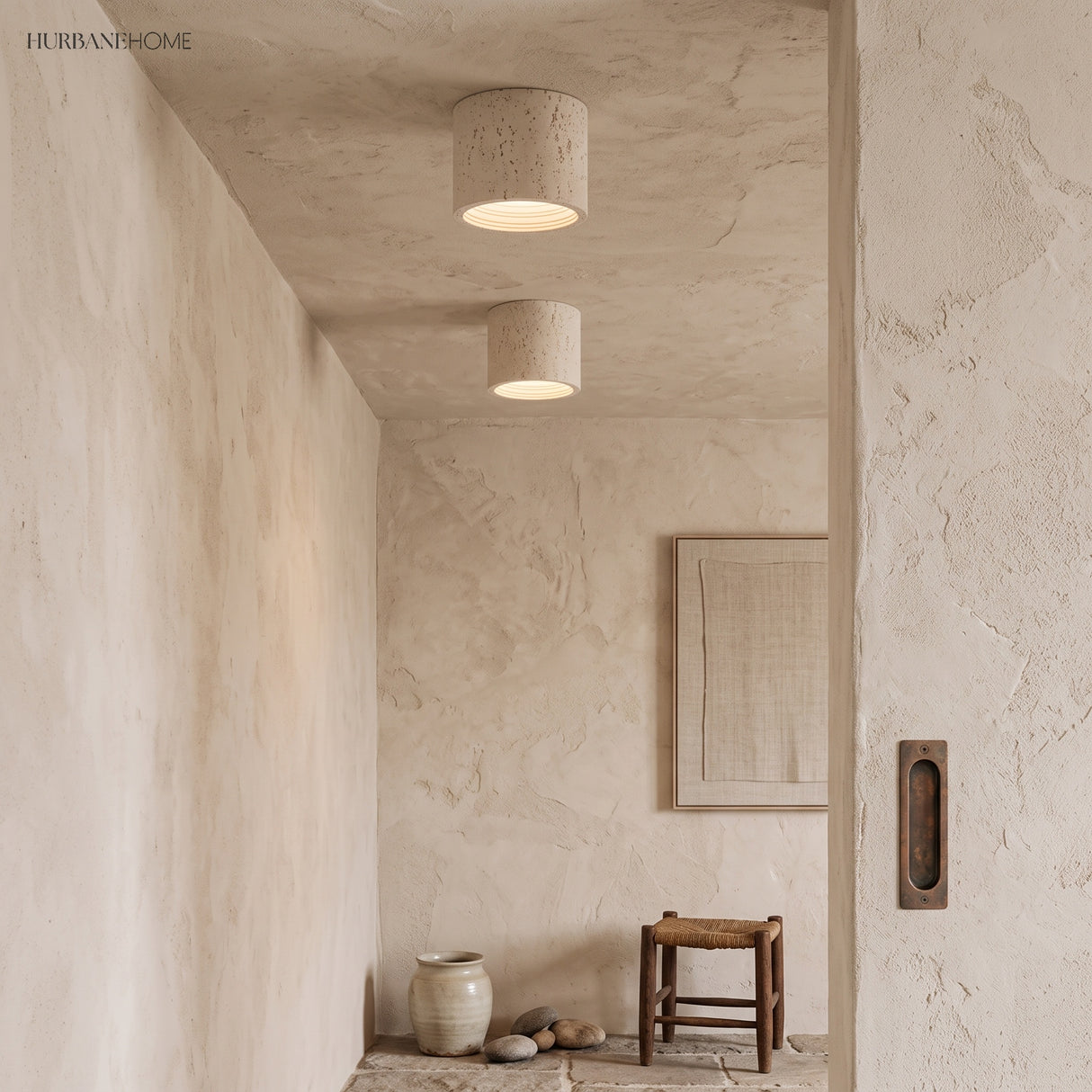 Pair of cream flush mount ceiling lights in a minimalist plaster corridor