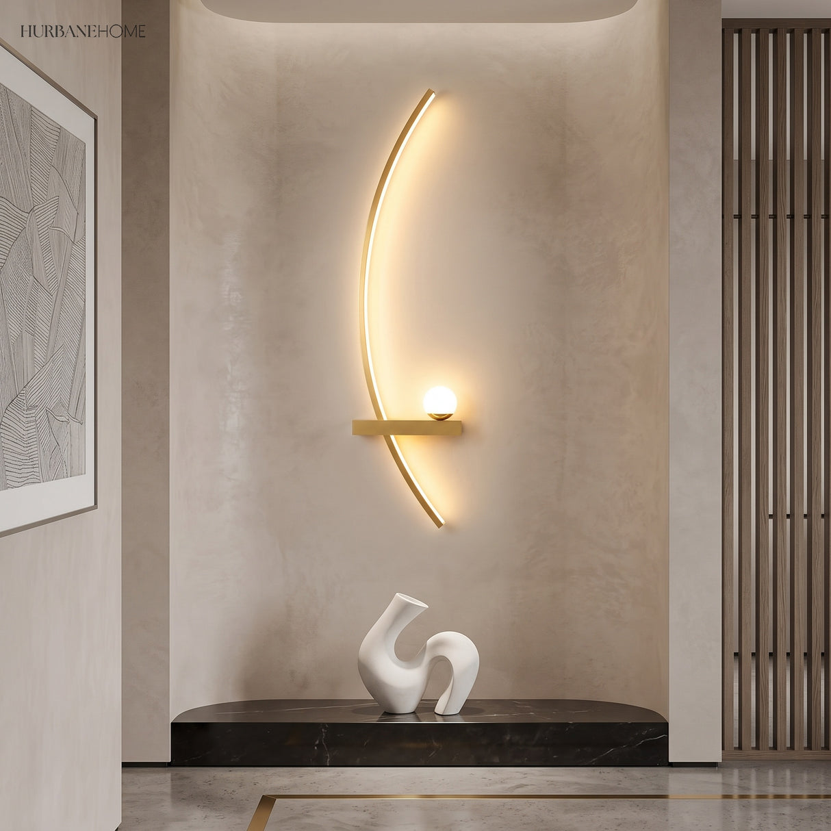 Gold curved linear wall sconce glowing warm above a hallway console table