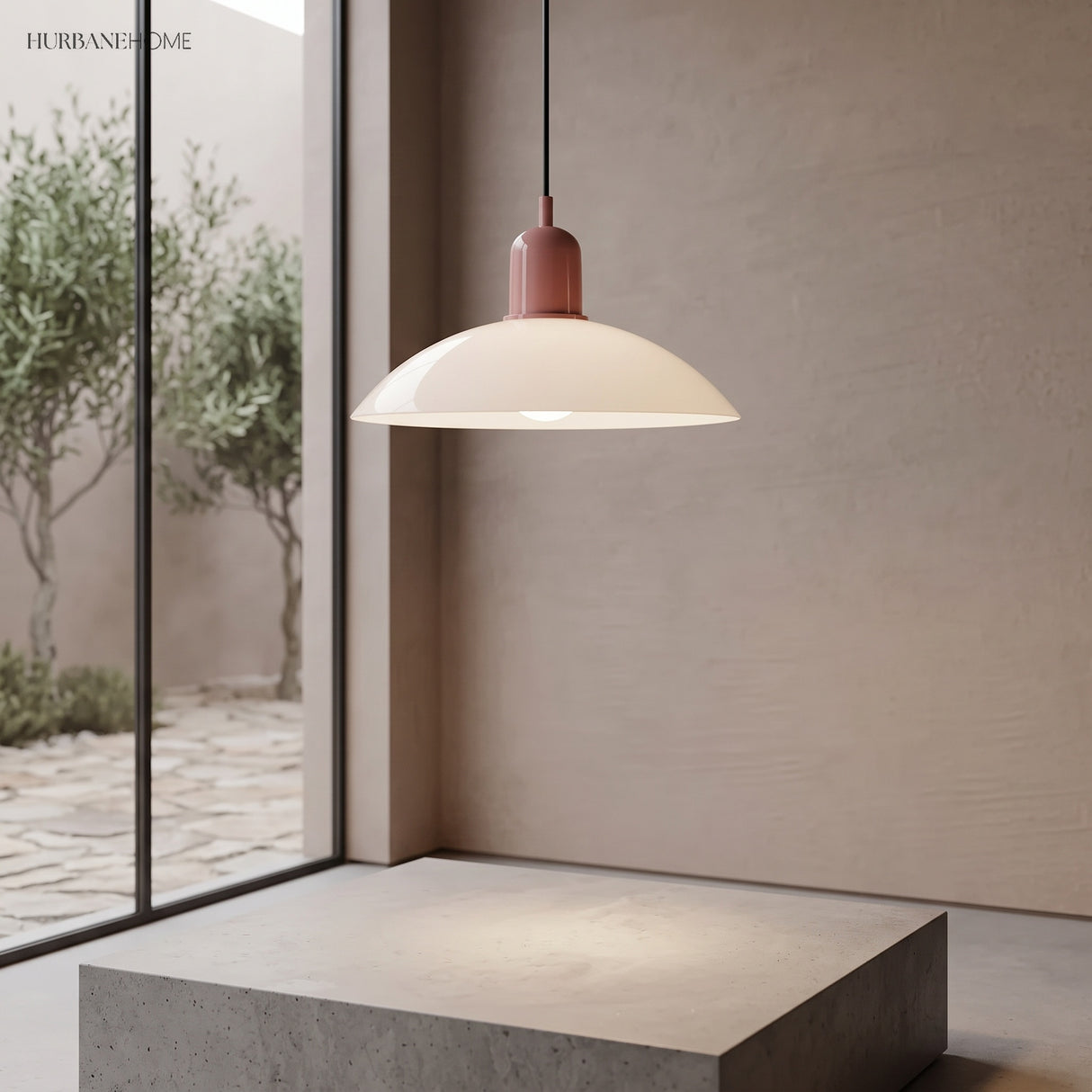 Cream disc pendant light near a tall window with a garden view