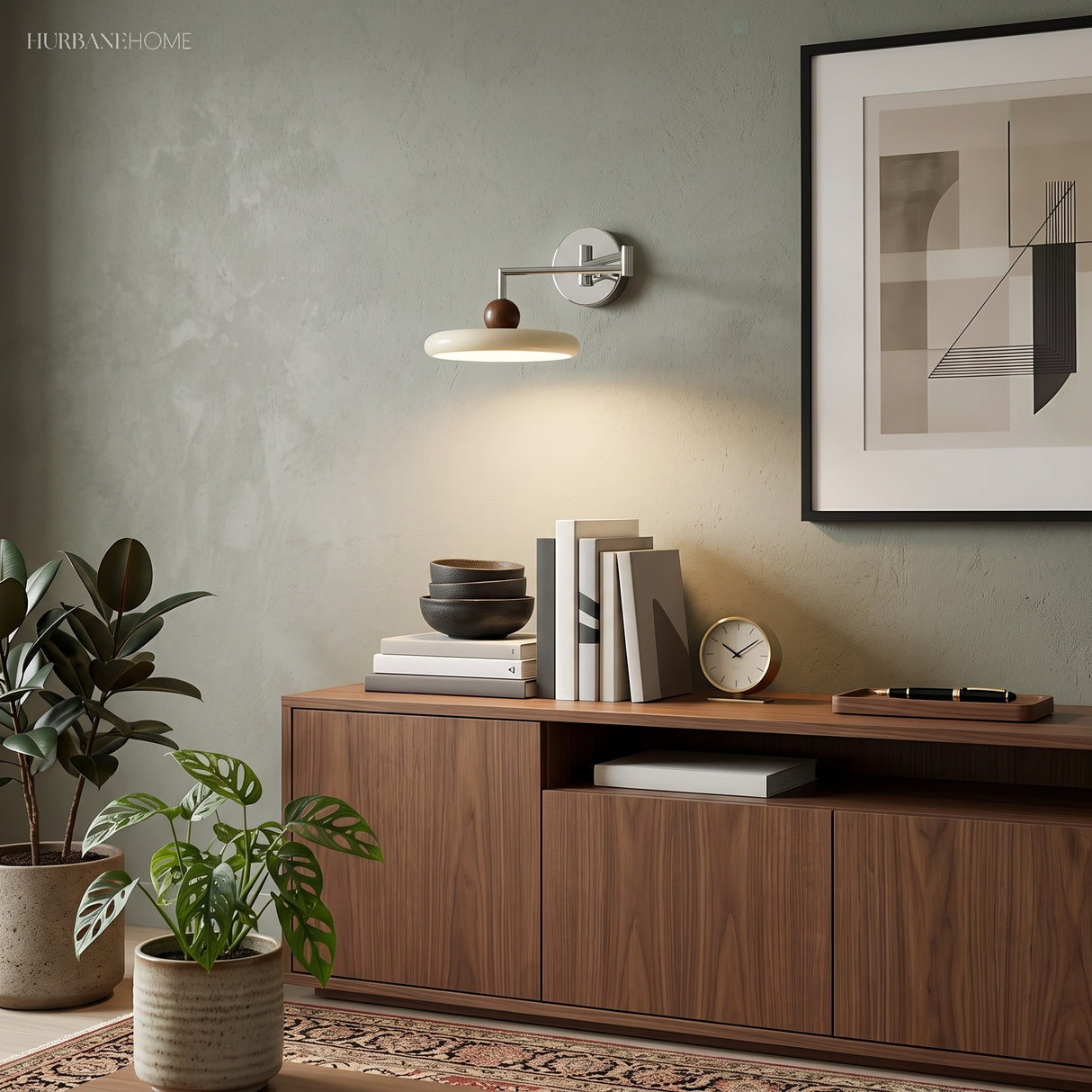 Adjustable wall lamp with cream disc shade above a walnut sideboard