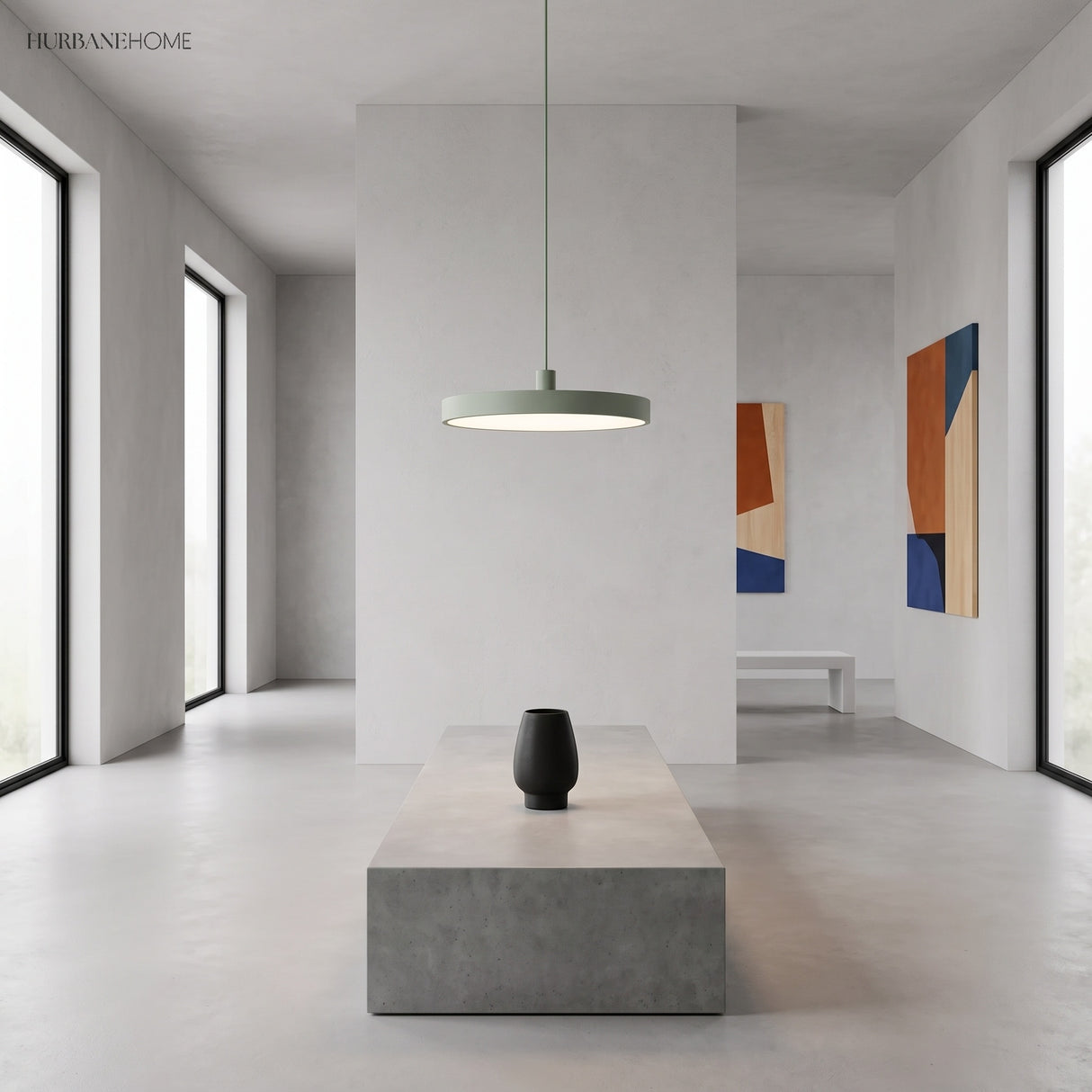 Single grey disc pendant lighting a bright minimalist gallery style interior