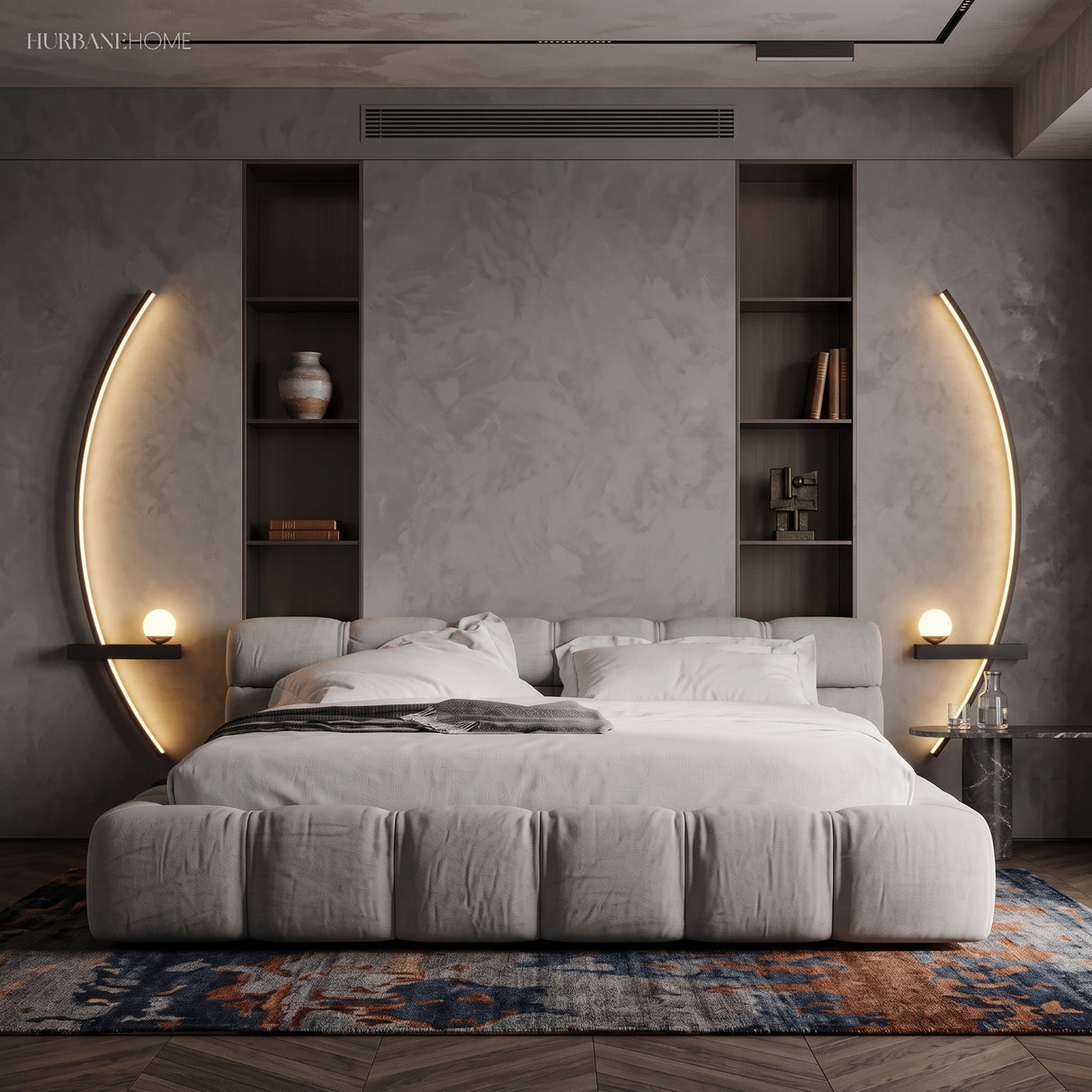 Two black crescent LED sconces flanking a bed in a grey bedroom