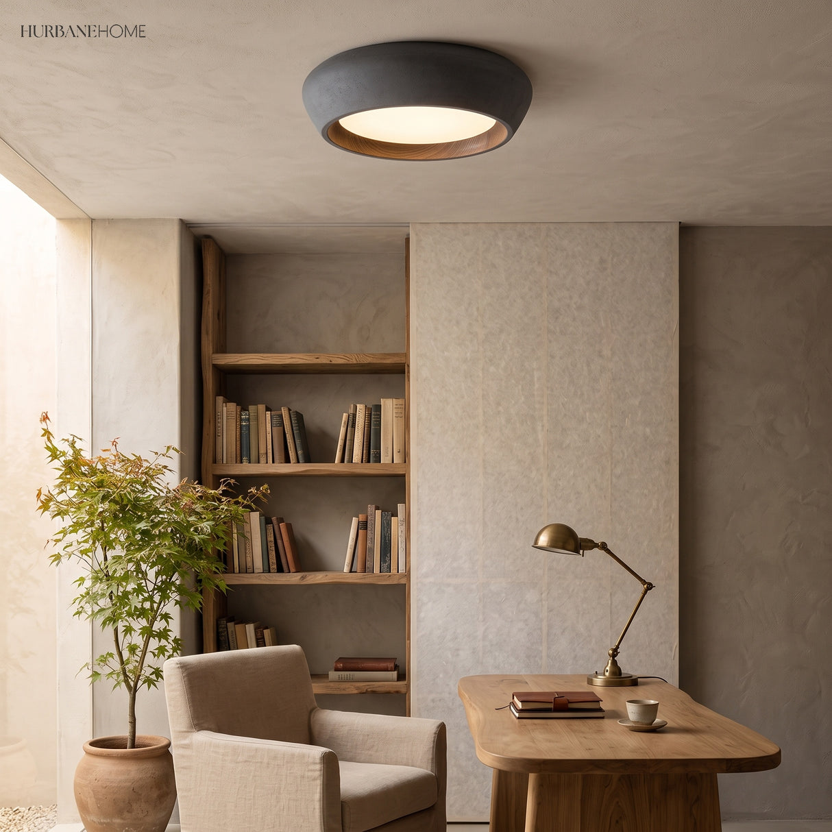 Brown toned flush mount ceiling light above a wooden study with brass task lamp