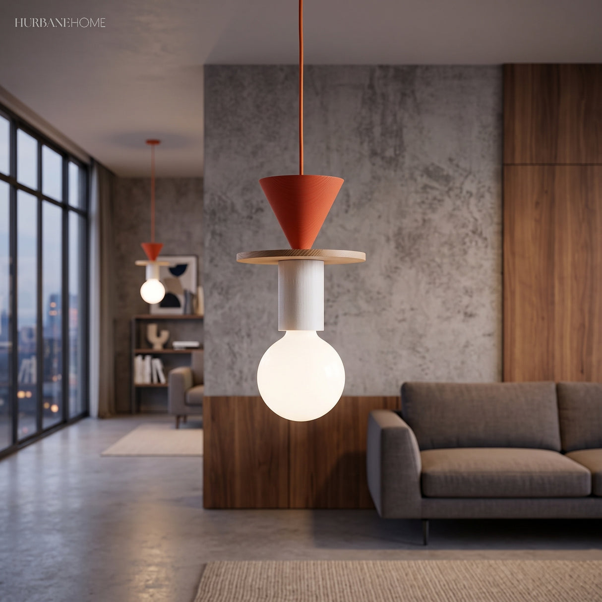 Orange cone wood pendant light lighting a modern concrete living room with a sofa