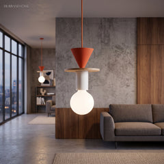 Orange cone wood pendant light lighting a modern concrete living room with a sofa