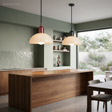 Colorful glass bowl pendant light styled in a bright modern living space