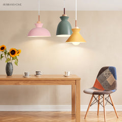Cluster of Scandinavian pendant lights lighting a cosy dining and living space