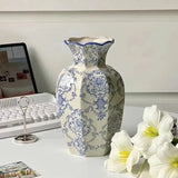 Light blue and white ceramic vase with glossy finish
