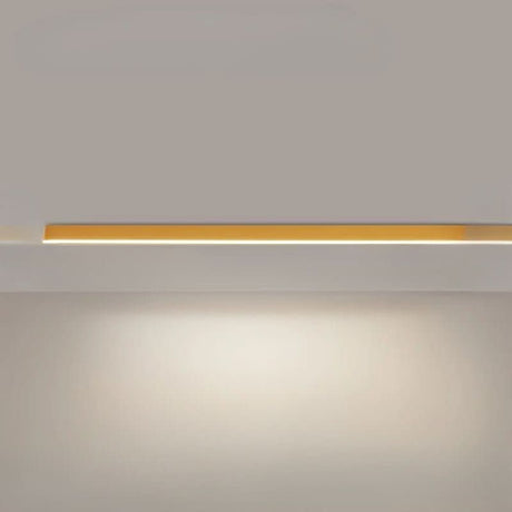 Long linear LED ceiling fixture running across a modern room ceiling