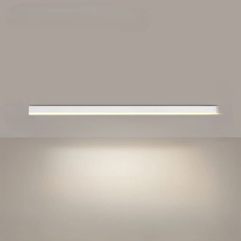 Linear LED ceiling light installed over a contemporary dining space