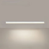 Linear LED ceiling light installed over a contemporary dining space