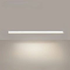Linear LED ceiling light installed over a contemporary dining space