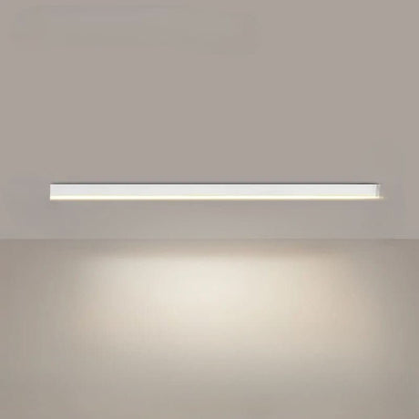 Linear LED ceiling light installed over a contemporary dining space