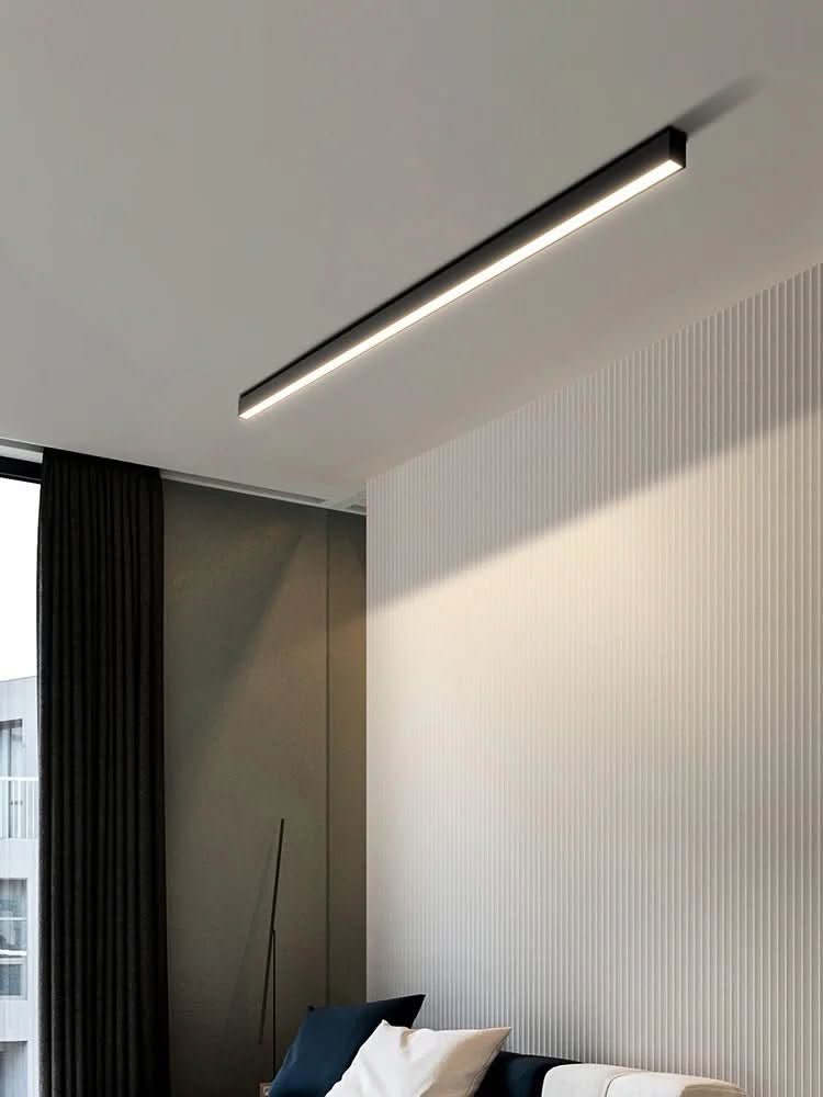 Gold finish linear LED ceiling light detail with warm light strip