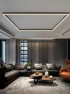 Slim LED ceiling bar casting even light down a modern hallway