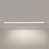 Linear LED ceiling light casting soft light in a minimalist workspace