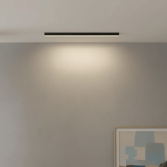 Close view of the slim aluminum linear LED fixture with glowing diffuser