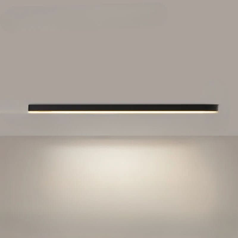 Linear LED ceiling light lit and mounted in a bright modern space