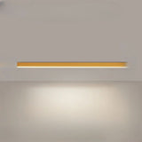 Slim black LED ceiling bar mounted flush against a white ceiling