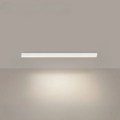 Linear LED ceiling light shown from below with a bright even glow